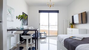 Laptop workspace, iron/ironing board, WiFi, bed sheets - Spacious + Stylish Studio in Lakeside Impz (Dubai)