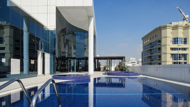 Outdoor pool - Visually Unique 1BR Apartment in JLT - Sleeps 4! (Dubai)