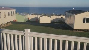 A balcony with a view of a marina and several small boats. - Immaculate 3-bed Caravan in Hartlepool (Hartlepool)