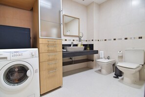 Bathtub, hair dryer, towels