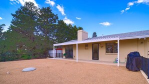 A single-story house with a covered porch, a fenced backyard, and a garage. - Stay and Play! *Golfers Retreat *Budget Friendly (Prescott)