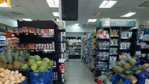 A grocery store aisle with produce and packaged goods. - El Cometa. Walk to the beach! (Tamarindo)