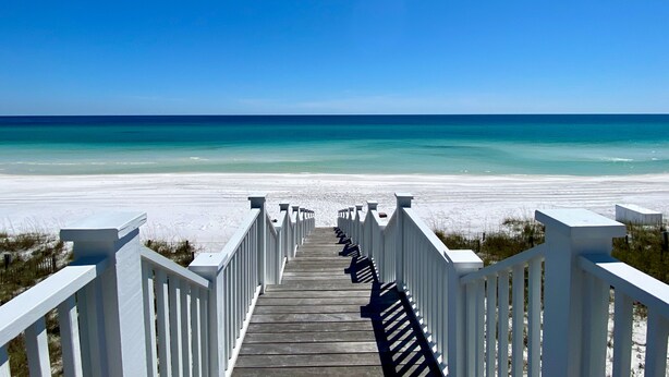 A wooden boardwalk leading to a beach with white railings. - Gulf Views from Tower in Seaside, 6 Houses to Private Beach & 2 Adult Bikes! (Santa Rosa Beach)