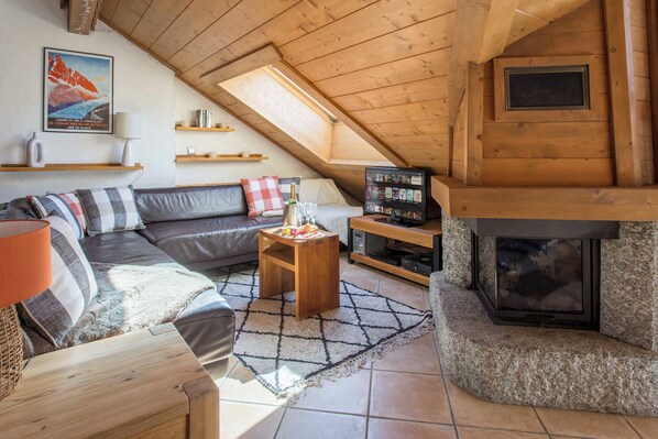 Lounge area with TV and fireplace