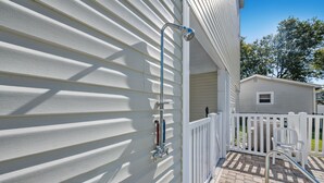 A residential exterior with a white fence, a covered patio, and a metal railing. - 1 Precious Memory - 4 Bed/3 Bath - Private Pool (North Myrtle Beach)