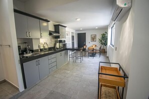 Fridge, microwave, stovetop, coffee/tea maker