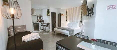 1 bedroom, desk, iron/ironing board, travel crib