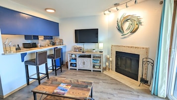 Condo | Living area | 40-inch flat-screen TV with cable channels, Smart TV, fireplace