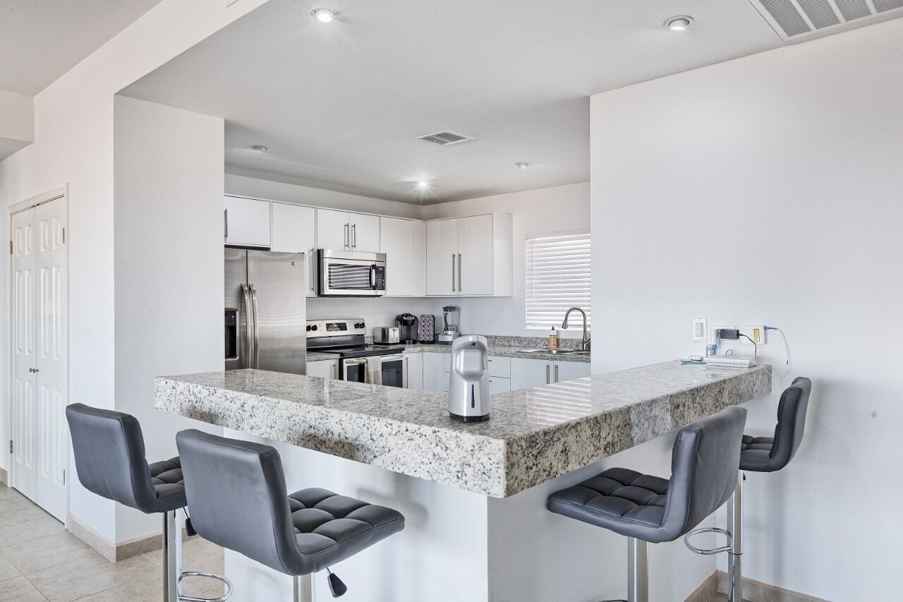 Microwave, dishwasher, coffee/tea maker, cookware/dishes/utensils