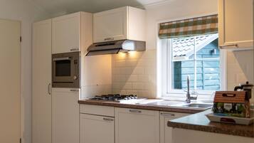 Microwave, dishwasher, highchair, dining tables