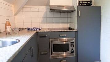 Microwave, dishwasher, highchair, dining tables