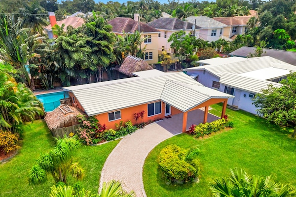 Welcome to Fort Lauderdale! This 3BR home features a landscaped pool area.