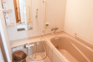 Private Vacation Home | Bathroom | Separate tub and shower, hair dryer, slippers, electronic bidet