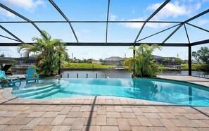 A heated pool, sun loungers