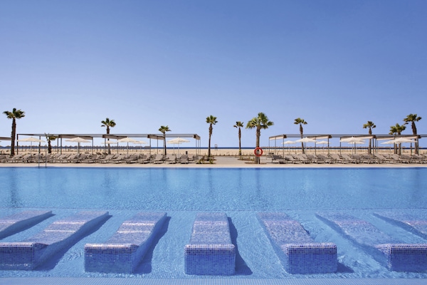 Indoor pool, 5 outdoor pools, pool umbrellas, pool loungers