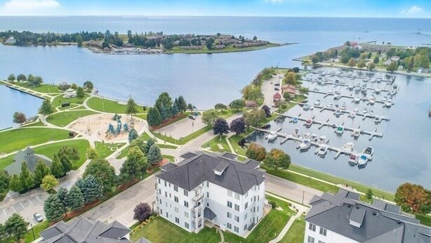 A residential area with a marina, a swimming pool, and a large building with multiple windows.