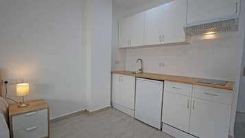 Mini-fridge, stovetop, cookware/dishes/utensils