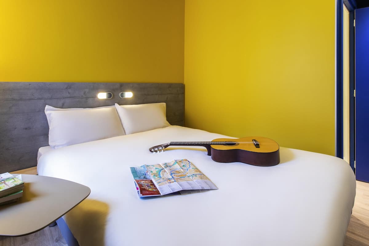 Premium bedding, pillow-top beds, desk, blackout curtains