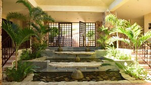 A courtyard with a water feature, stone steps, and tropical plants. - Luxury Pacific View Villa, Cabo San Lucas Villa 1005 (Cabo San Lucas)