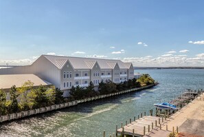 A waterfront property with a dock and a boat.