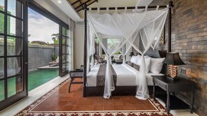 A spacious bedroom with a large bed, a nightstand, and a view of a swimming pool. - Exclusive Holiday Villa with Private Pool and Staff in Umalas, Bali Villa 2079 (Bali)