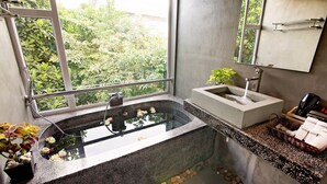 A bathroom with a large window, a freestanding bathtub, a sink, and a mirror. - Damnak Villa Boutique (Siem Reap)