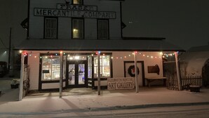 A historic building with a sign reading "Fraser Mercantile Company" and "Elizabeth Kurtak Art Gallery" below. - The Heart of Fraser (Fraser)