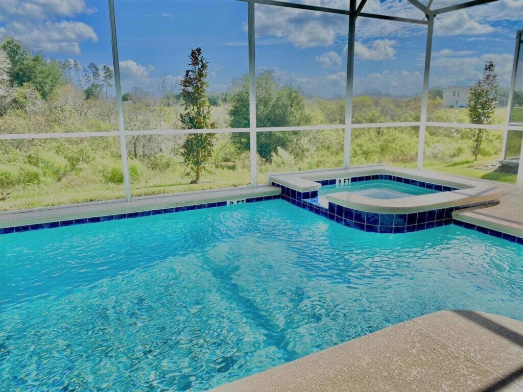 A swimming pool with a view of the surrounding landscape.