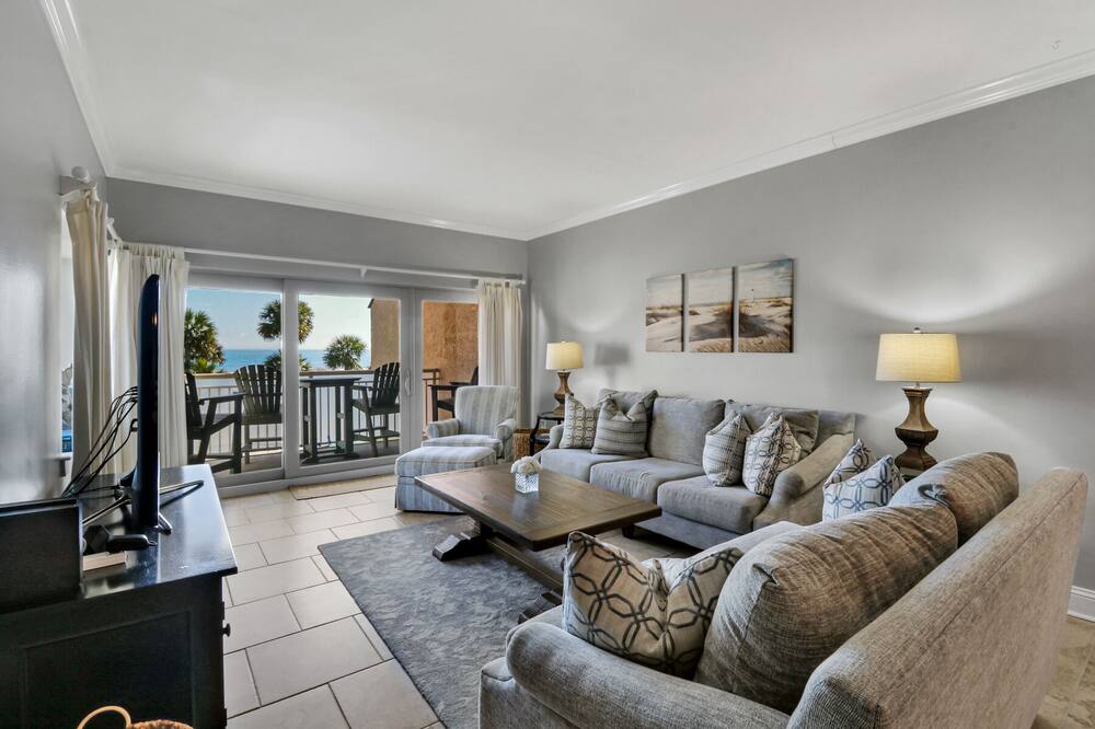 2nd floor renovated end unit w/ stunning pool, lagoon, and ocean views!