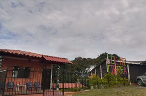 Experience the charm of Demita Terra, surrounded by lush greenery and a tranquil atmosphere.