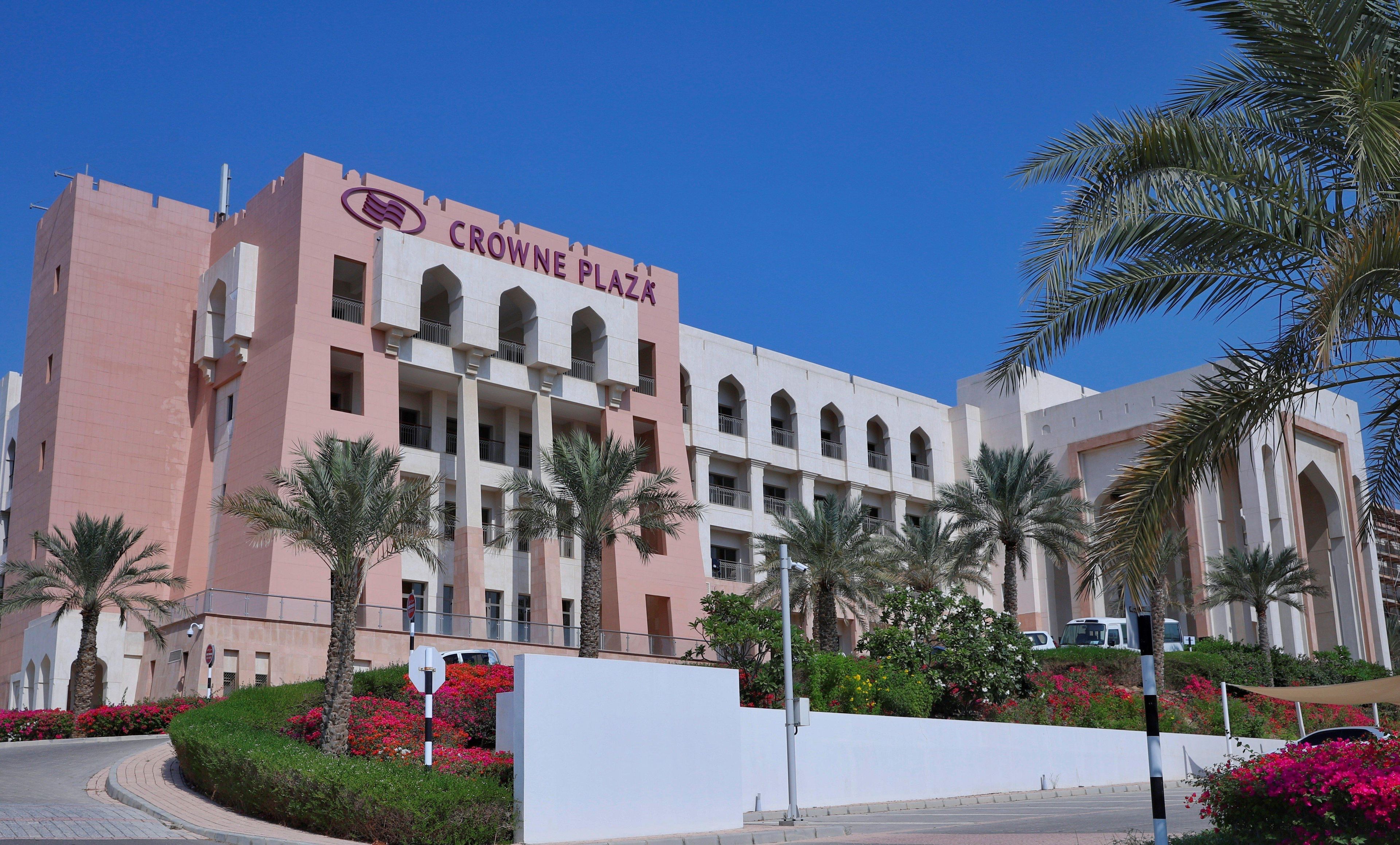 A building with the sign 'CROWNE PLAZA' indicating a hotel.