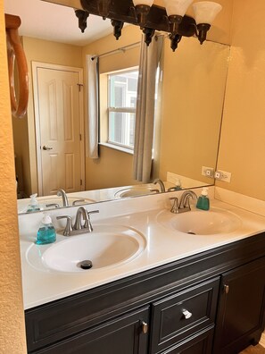 Combined shower/tub, hair dryer, towels, soap