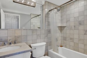Combined shower/tub, hair dryer, towels, soap