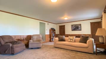 Smart TV, fireplace, books, printers