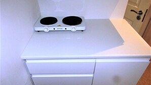 A white cabinet with a built-in microwave on top. - Stylish Private Double En-suite - 1 (London)