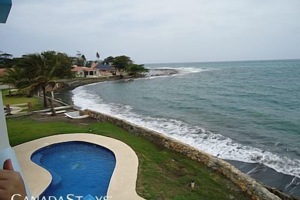 New protective sea wall partially obscures the center of this former view