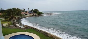 Spacious Beach House on the ocean front with huge pool and patio.
