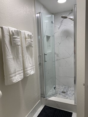 Combined shower/tub, hair dryer, towels, soap