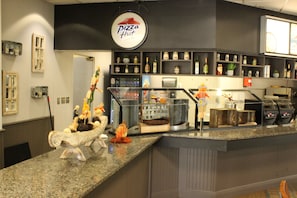 Enjoy a meal at this restaurant, where a variety of food and decorative items are on display.