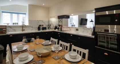 Two separate 2-bedroom apartments, joined by a private hallway. Kendal Town Centre