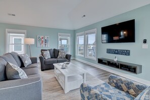 Flat-screen TV, DVD player, foosball