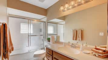 Combined shower/bathtub, hair dryer, towels, toilet paper