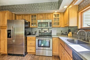 Fridge, stovetop, dishwasher, coffee/tea maker