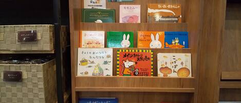 A wooden bookshelf with various children's books.