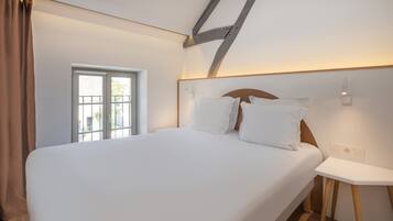Premium bedding, pillow-top beds, blackout curtains, soundproofing