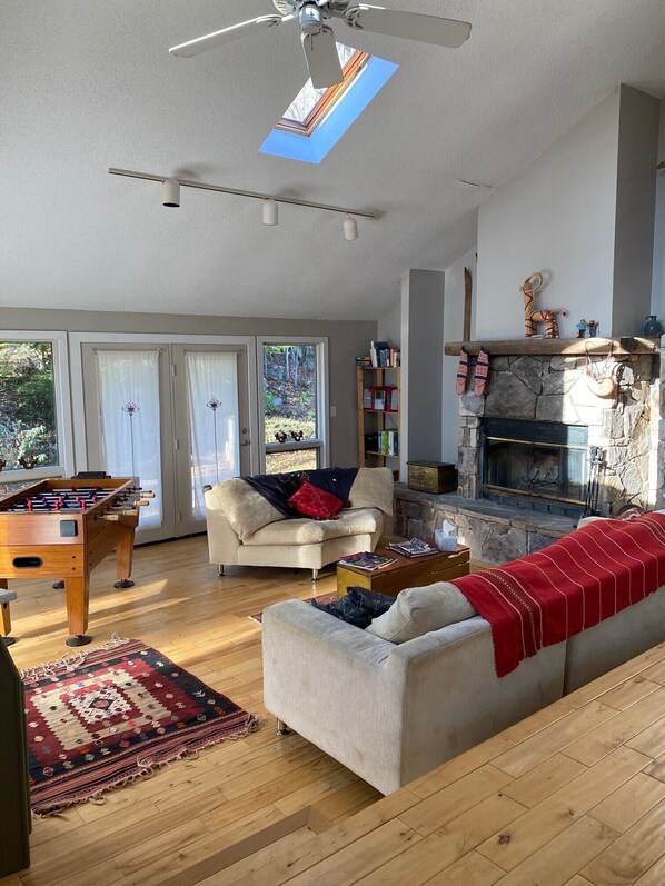 Fireplace, video games, DVD player, table football