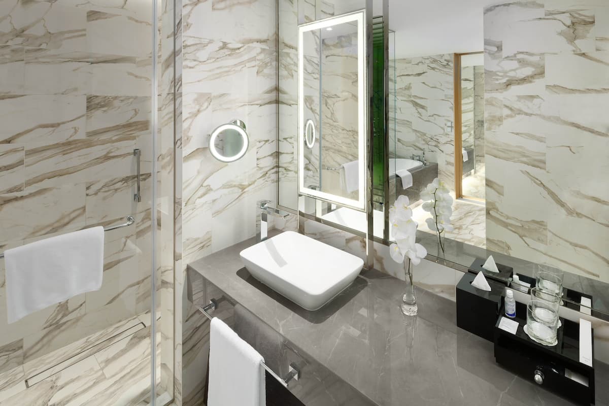 hair dryer, bathrobes, slippers, towels