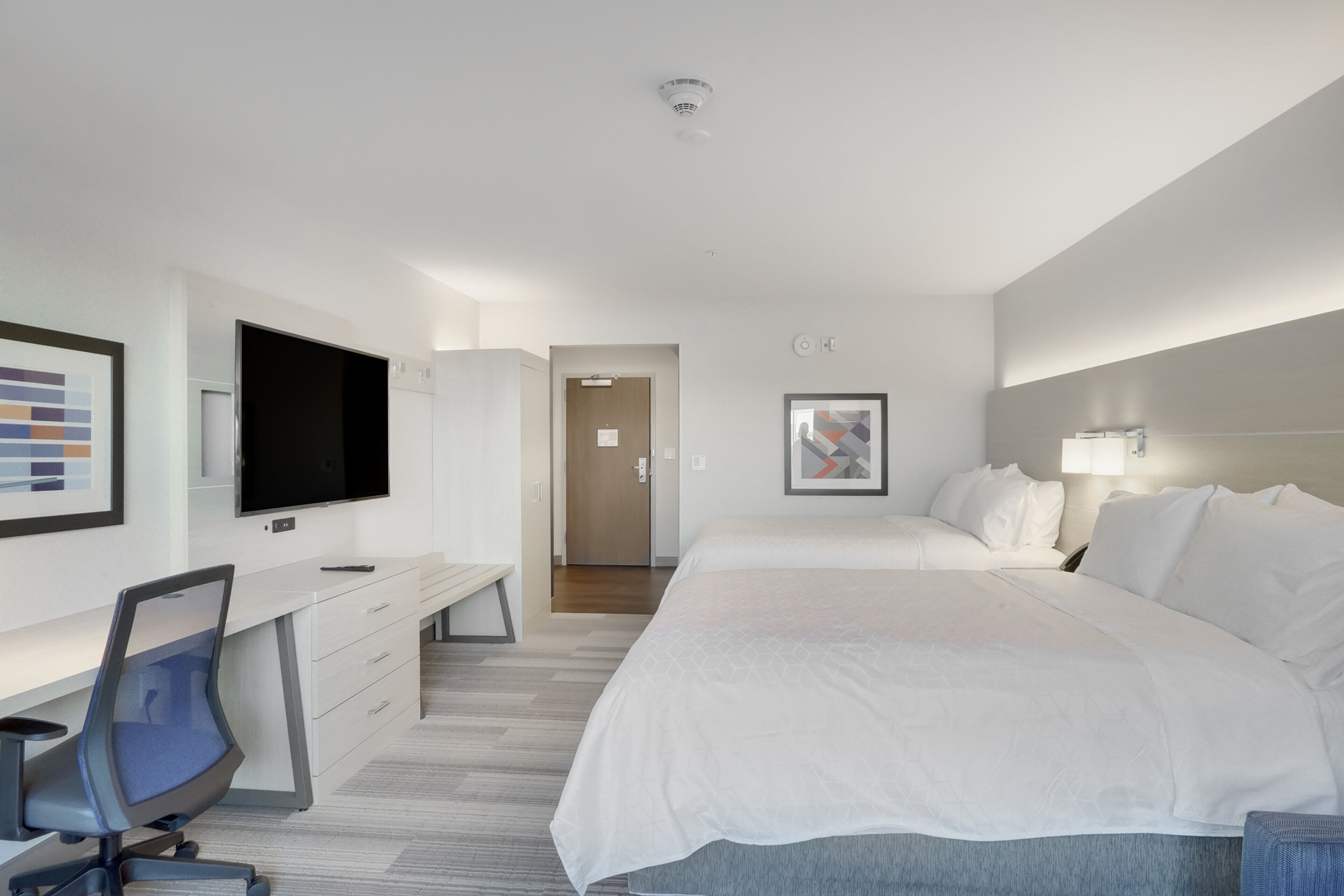 premium bedding, memory-foam beds, desk, laptop workspace