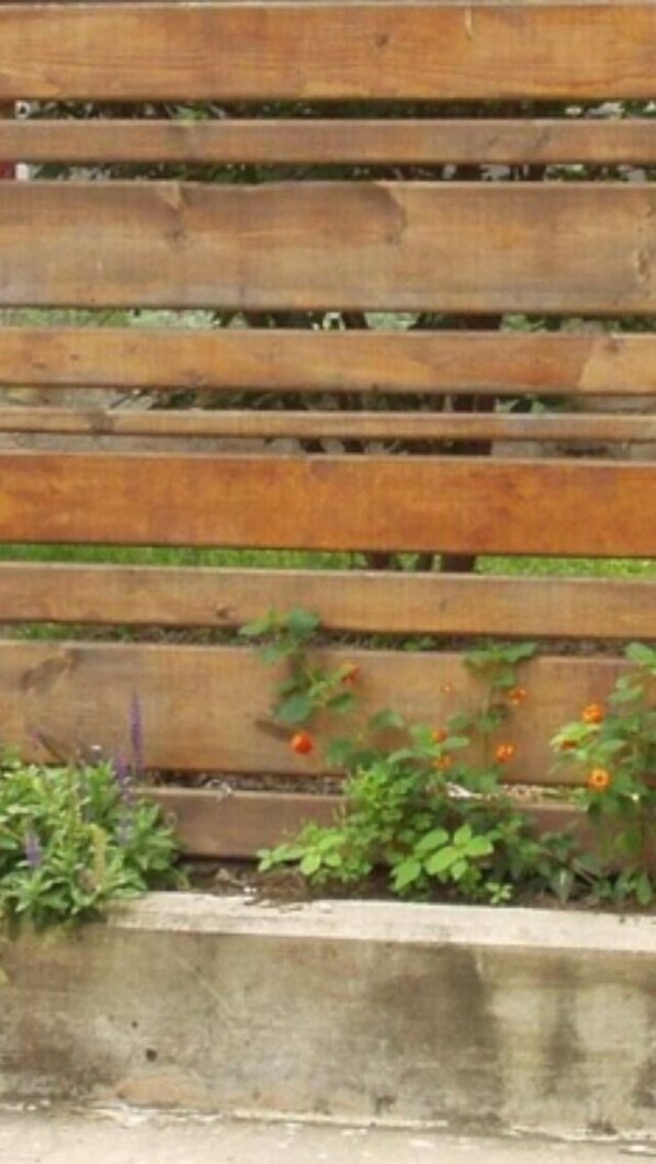 A wooden fence with horizontal slats.