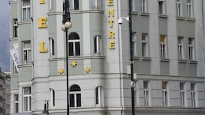A historic building with the words "HOTEL CITY CENTRE" on its facade, featuring classic architectural details and a prominent corner location. - City Centre (Prague)